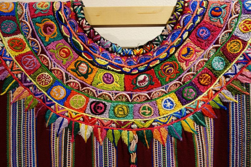 A Huipil, Kaqchikel Maya, Patzun textile displayed in the Textile Museum of Canada, circa late 20th to early 21st c. Such textiles are an important Maya tradition and are still made by Maya weavers today.
