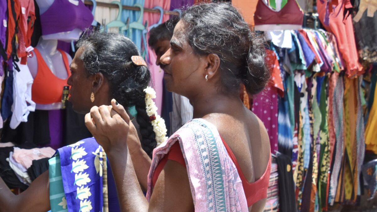 Two hijras in Tiruchirappali market, India. Image via Flickr by Richard Mortel. CC BY 2.0.